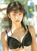 Spunky gravure babe is adorable in her blue dress and pig tails