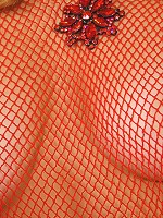 Teen wears see-thru red fishnet dress