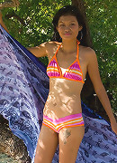 Sexy petite Thai babes strip out of bikinis on the beach