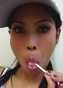Hot THai babe named Ni licks and sucks a lolipop to tease us