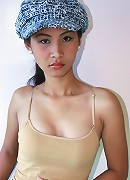 Nude Filipina model Nelly struts her nubile body for the camera