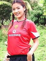 Soccer girl Arisa Sunaree strips out of her uniform on the field